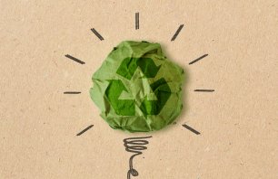 Light bulb drawing with recycling sign on crumpled recycled paper - Concept of ecology and recycling